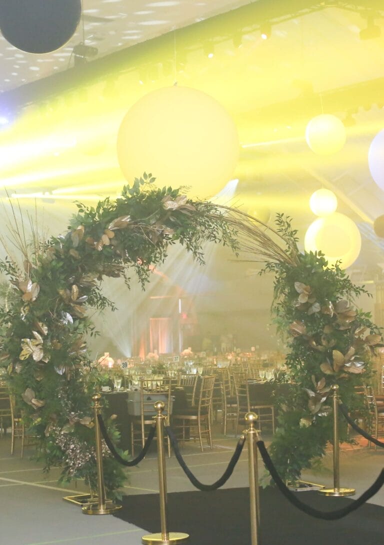 gala event decor arch tropical summer gold